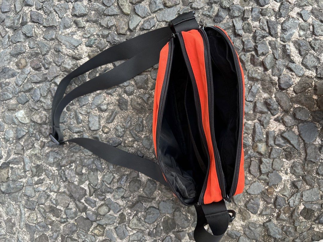 Places + Faces Pouch bag (Category: Sling Bags) located in Quezon City. Submitted by shanks. (Listing ID 1470148096, Image 3). Description: Places + Faces Pouch Bag featuring a bold white brand logo across the top, a black mesh outer pocket with a zipper, and an adjustable black shoulder strap. Sign of wear in good condition Dimensions : Height : 7 inches Width : 12 inches .