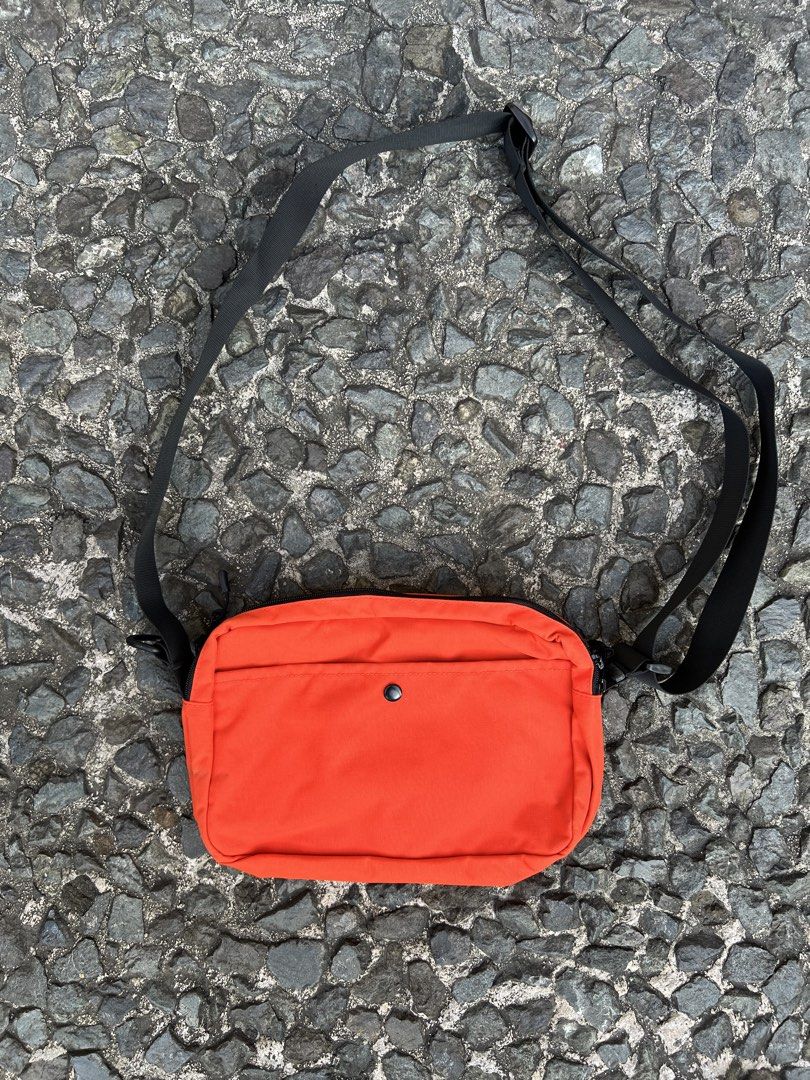Places + Faces Pouch bag (Category: Sling Bags) located in Quezon City. Submitted by shanks. (Listing ID 1470148096, Image 2). Description: Places + Faces Pouch Bag featuring a bold white brand logo across the top, a black mesh outer pocket with a zipper, and an adjustable black shoulder strap. Sign of wear in good condition Dimensions : Height : 7 inches Width : 12 inches .