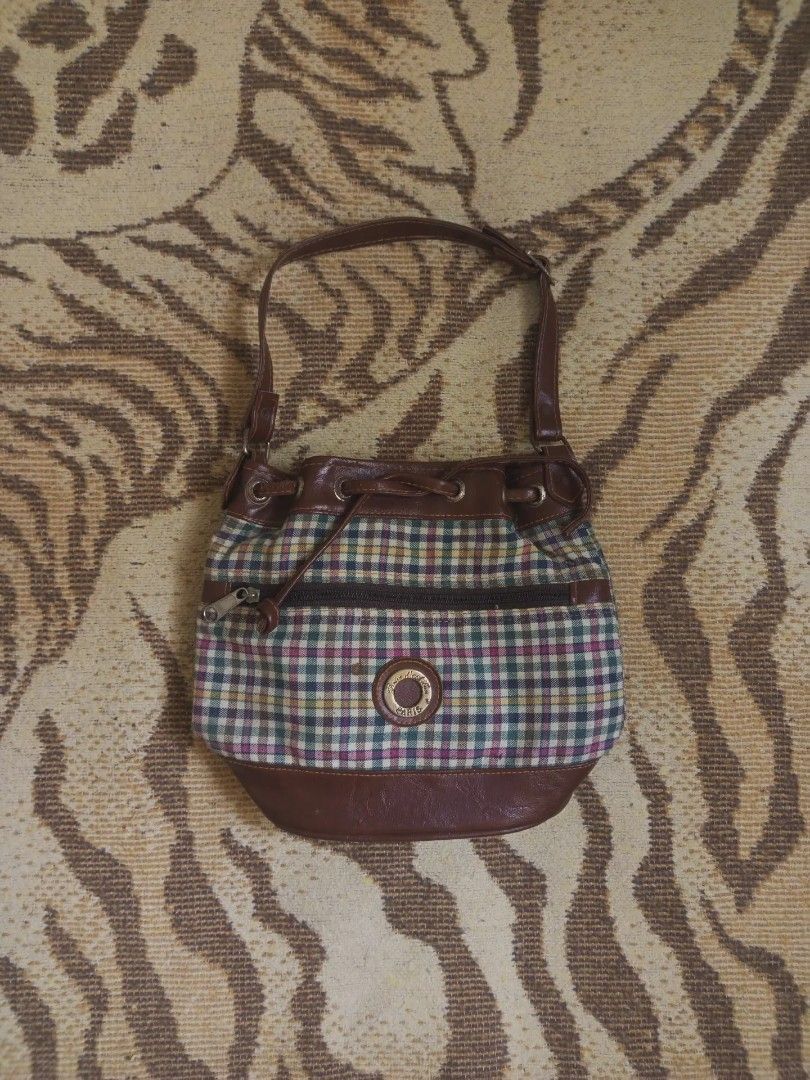 plaid bucket bag (Category: Shoulder Bags) located in San Pedro. Submitted by vishavriksha (Listing ID 1470197296, Image 1). Description: ‎༝ size : 10" x 9" ‎༝ brand : Brice d'Alban Paris (vintage brand) ‎༝ flaws : peeling/cracking on the top brown trim around the drawstring area, plus a small dark spot on fabric near the logo badge. the interior is very clean with no damage !.
