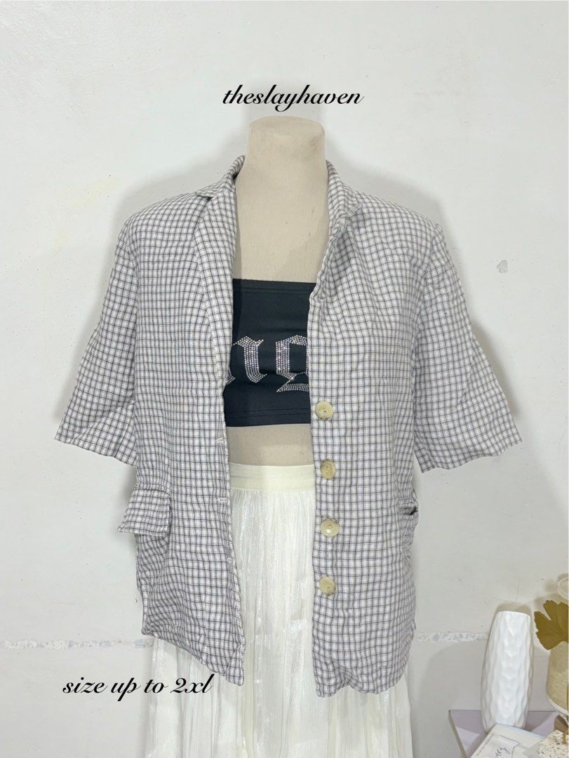 Plaid Short Sleeve Blazer Jacket (Category: Coats, Jackets and Outerwear) located in Manila. Submitted by biacakes (Listing ID 1470263303, Image 1). Description: - Design: Classic grey and white plaid pattern - Fit: Relaxed fit, fits up to 2XL - Details: Short sleeves, lapel collar, front button closure, and front flap pockets - Style: Versatile layering piece for casual wear or work outfits.
