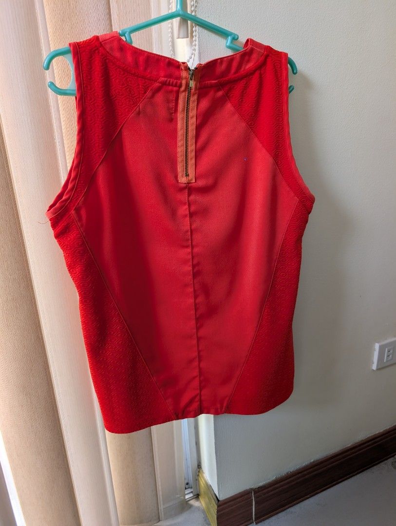 Plains & Prints Red Sleeveless Top (Category: Sleeveless) located in Paranaque City. Submitted by clothingarchives (Listing ID 1470164723, Image 2). Description: - Brand: Plains & Prints - Color: Bright solid red - Size: PHL Medium (EUR 10, USA 6) - Details: Sleeveless, round neckline, textured patterned panels on shoulders and sides, exposed back zipper - Styling: Easy to pair with skirts or pants for work or casual days.