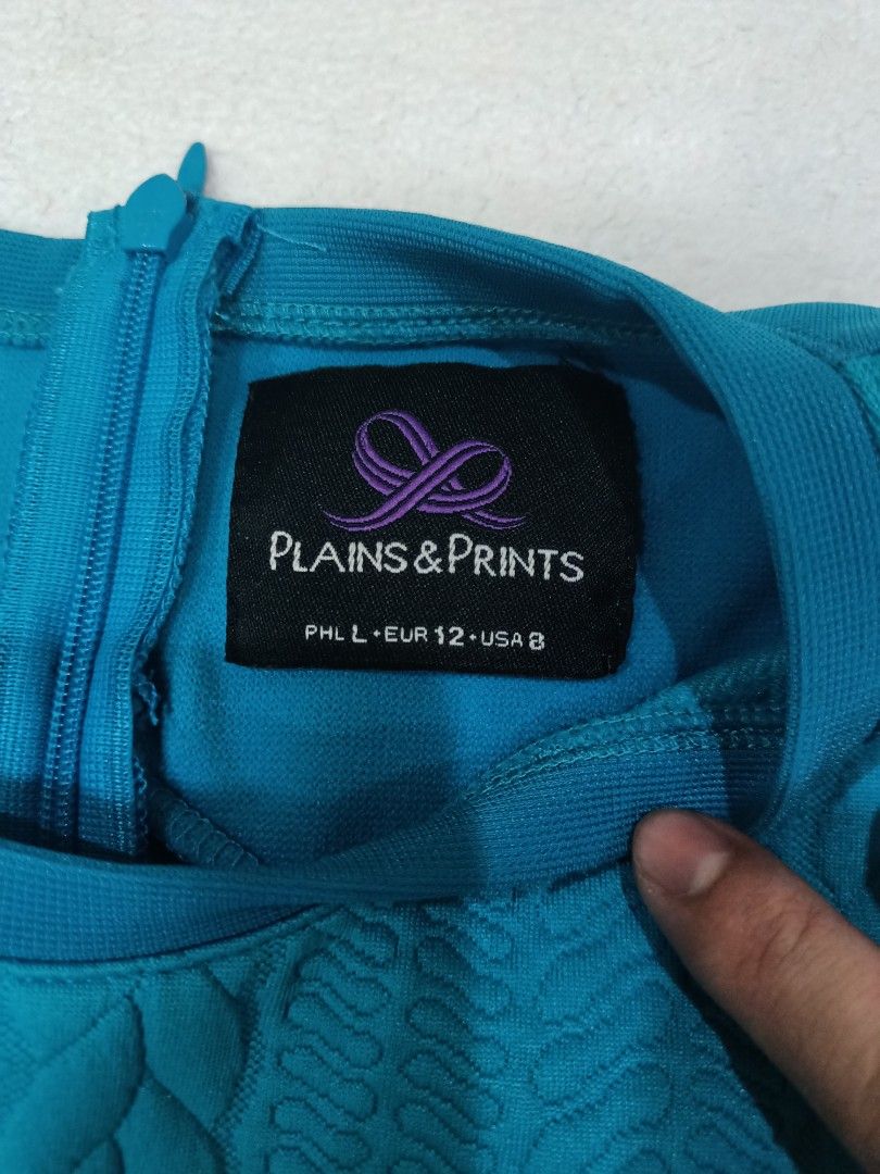 Plains & Prints Teal Peplum Top Size L (Category: Sleeveless) located in Manila. Submitted by jollynest24 (Listing ID 1470279852, Image 2). Description: - Brand: Plains & Prints - Color: Teal - Size: PHL L / EUR 12 / USA 8 - Design: Sleeveless with a textured front panel and peplum hem - Closure: Back zipper - Condition: Like new. Great for office wear and smart casual outfits - Location : Sampaloc Manila - Gcash ( MOP) .