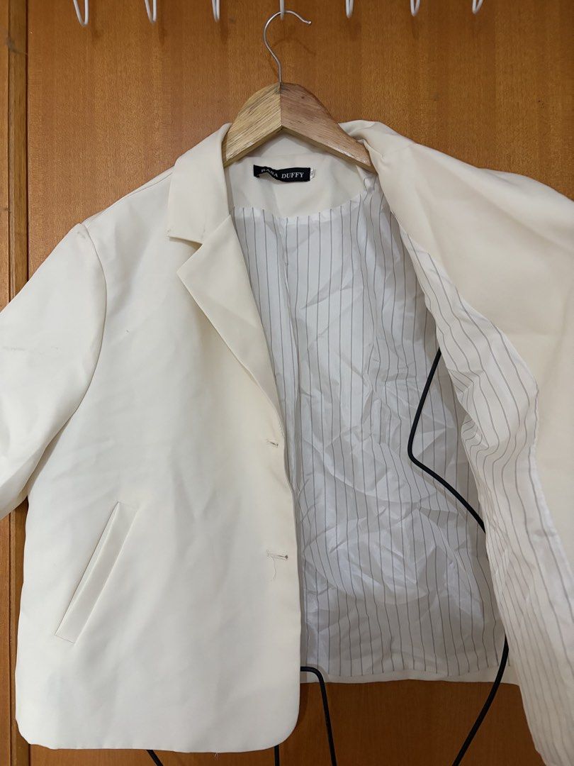 Plus size blazer/coat (Category: Coats, Jackets and Outerwear) located in Taguig. Submitted by jgbrl_03 (Listing ID 1470218934, Image 2). Description: - Brand/Model: Rasa Duffy cream short sleeve blazer - Design: Notch lapels, two front buttons, and two functional pockets - Lining: Chic white and grey vertical stripe inner lining - Best fit: Large to semi xl body frame -Worn once -Condition: Premium Quality.