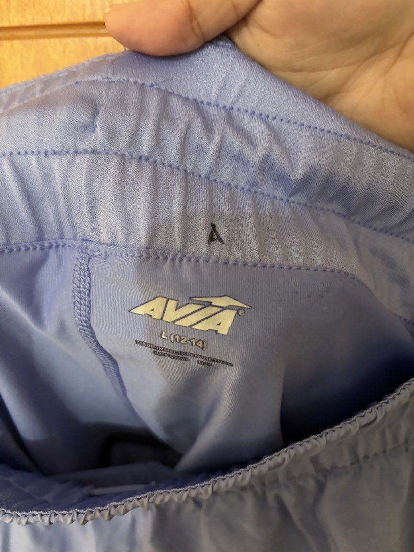 Plus size exercise shorts (Category: Activewear) located in Taguig. Submitted by jgbrl_03 (Listing ID 1470213604, Image 2). Description: - Brand: Avia - Size: L (12-14) - Best fit: 33-34 waistline - Color: Purple - Condition: Excellent - Fit & Comfort: Elastic waistband for a secure, comfortable fit - Features: Built-in inner lining for extra coverage during workouts and with pockets - Ideal for: Running, gym sessions, and activewear.