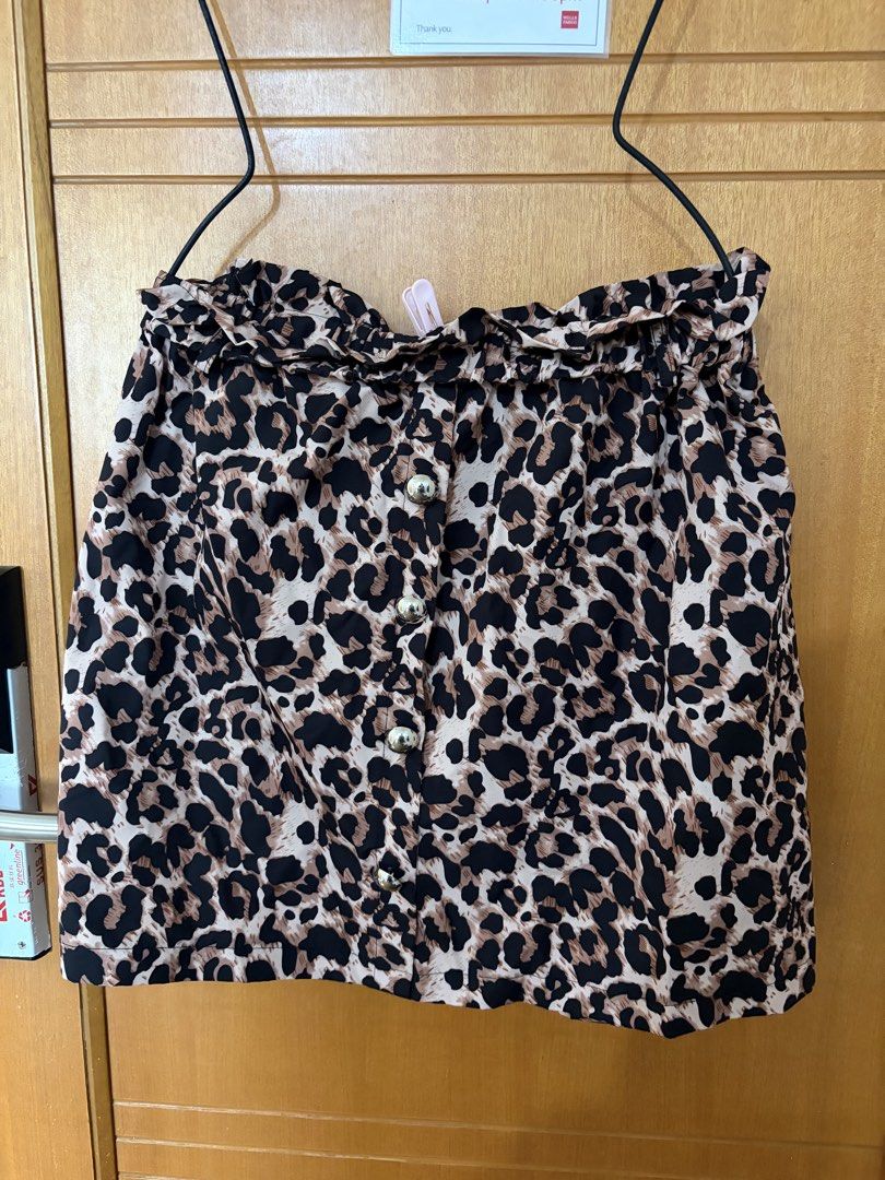 Plus size skirt (Category: Skirts) located in Taguig. Submitted by preloved_by_janel (Listing ID 1470223891, Image 1). Description: - Trendy leopard print in brown, black, and cream - Ruffled high waist design - Shiny silver decorative front buttons -Best fit: 38-40 inches waistline .