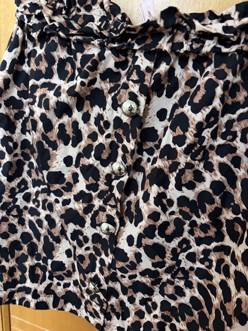 Plus size skirt (Category: Skirts) located in Taguig. Submitted by preloved_by_janel (Listing ID 1470223891, Image 2). Description: - Trendy leopard print in brown, black, and cream - Ruffled high waist design - Shiny silver decorative front buttons -Best fit: 38-40 inches waistline .