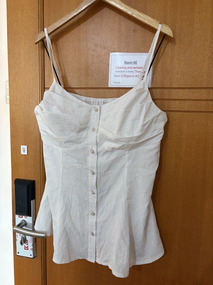 Plus size white sexy top (Category: Sleeveless) located in Taguig. Submitted by jgbrl_03 (Listing ID 1470212123, Image 1). Description: - White camisole top with delicate all-over floral embroidery - Features thin adjustable straps and cute decorative pearl-style buttons (design only) - Flattering ruched sweetheart neckline with gathered chest detail - Lightweight, breathable fabric with a lovely flared hemline - Versatile piece, easy to style wi