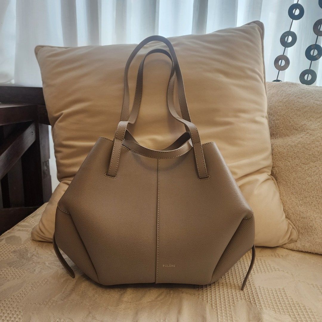 Polène Cyme mini, taupe (Category: Tote Bags) located in Mandaluyong City. Submitted by nnnightsss (Listing ID 1470177903, Image 2). Description: - Brand: Polène Cyme mini - Color: Textured grey-taupe - Material: Premium leather with tonal stitching - Straps: Dual shoulder straps and thin side straps with knot details - Origin: Made in Spain - Condition: Excellent with dustbag Php20K plus lsf rfs: haven't used it much.