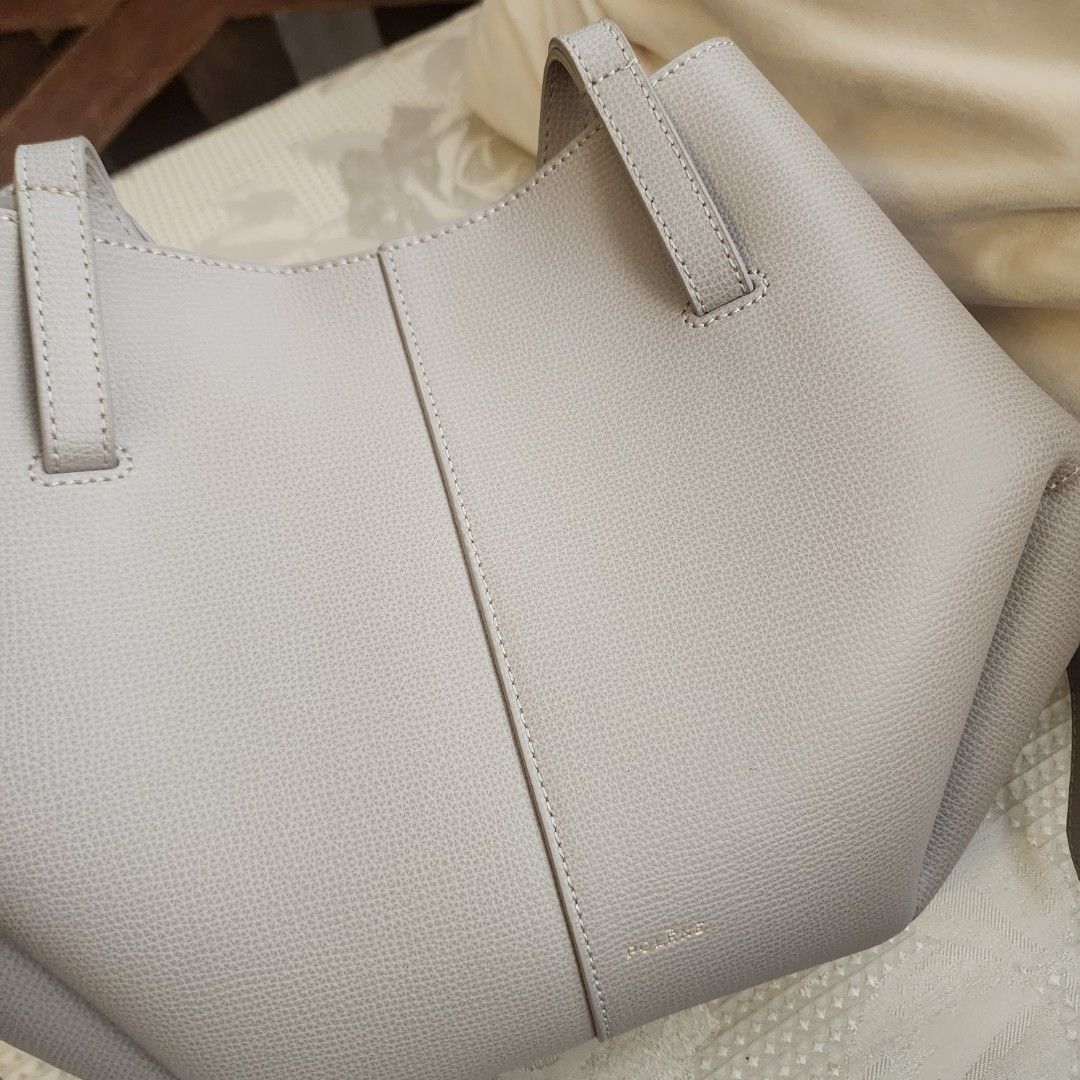 Polène Cyme mini, taupe (Category: Tote Bags) located in Mandaluyong City. Submitted by nnnightsss (Listing ID 1470177903, Image 3). Description: - Brand: Polène Cyme mini - Color: Textured grey-taupe - Material: Premium leather with tonal stitching - Straps: Dual shoulder straps and thin side straps with knot details - Origin: Made in Spain - Condition: Excellent with dustbag Php20K plus lsf rfs: haven't used it much.