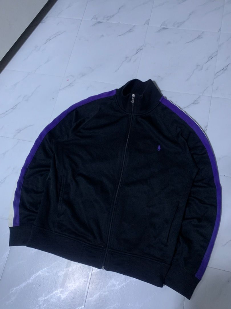 Polo by Ralph Lauren Track Jacket (Category: Coats, Jackets and Outerwear) located in Tarlac. Submitted by thriftniaki (Listing ID 1470327729, Image 1). Description: - Brand: Polo by Ralph Lauren - Item: Black track jacket - Size: Medium - Details: Purple stripes on sleeves, purple embroidered pony logo on chest - Features: Full zip front, stand-up collar, ribbed cuffs and hem - Condition: Good pre-loved condition.