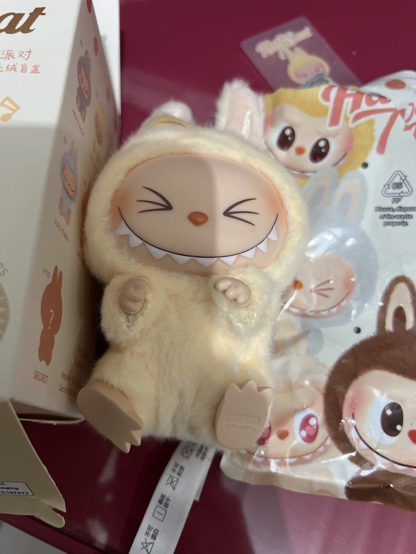 POP MART Labubu Have a Seat Plush (Category: Plushies & Soft Toys) located in Bulacan. Submitted by __randomthings (Listing ID 1470214534, Image 2). Description: - Authentic Labubu Have a Seat vinyl plush blind box figure - Color: Light yellow with fuzzy body, pointed ears, and signature sharp teeth - Condition: Box opened only to verify character, stored carefully - Inclusions: Complete with original foil packaging, character card, silica gel pa
