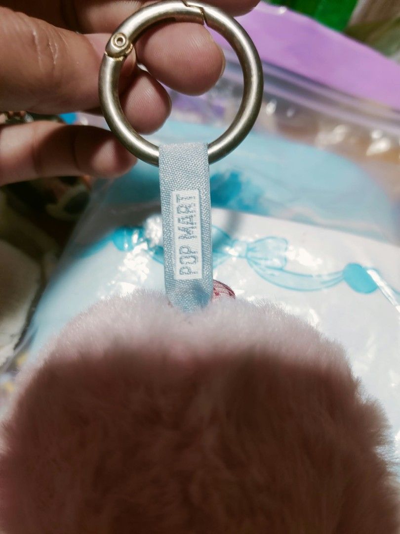 Pop Mart Skullpanda Plush Keychain Pink (Category: Plushies & Soft Toys) located in Manila. Submitted by jhs31 (Listing ID 1470308608, Image 3). Description: - 100% Authentic Pop Mart Skullpanda plush keychain - Soft pink fluffy body with sculpted pink hair - Detailed face makeup featuring a red heart and purple accents - Adorned with a plaid collar and silver ruffled trim - Includes a branded blue ribbon and round metal keyring - Comes with orig