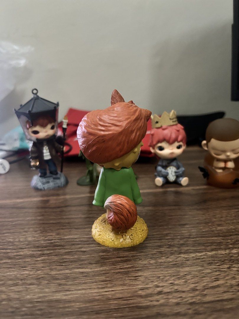 POPMART HIRONO FOX (Category: Figurines & Statues) located in Manila. Submitted by mihos.garage.sale (Listing ID 1470187265, Image 3). Description: - Authentic The Little Prince collectible vinyl figure - Design: Character in a green coat on a golden-yellow base, holding a reddish-brown fox - Condition: Carefully displayed on a shelf, excellent paintwork - Note: No box included - Perfect addition to any Little Prince collection!.