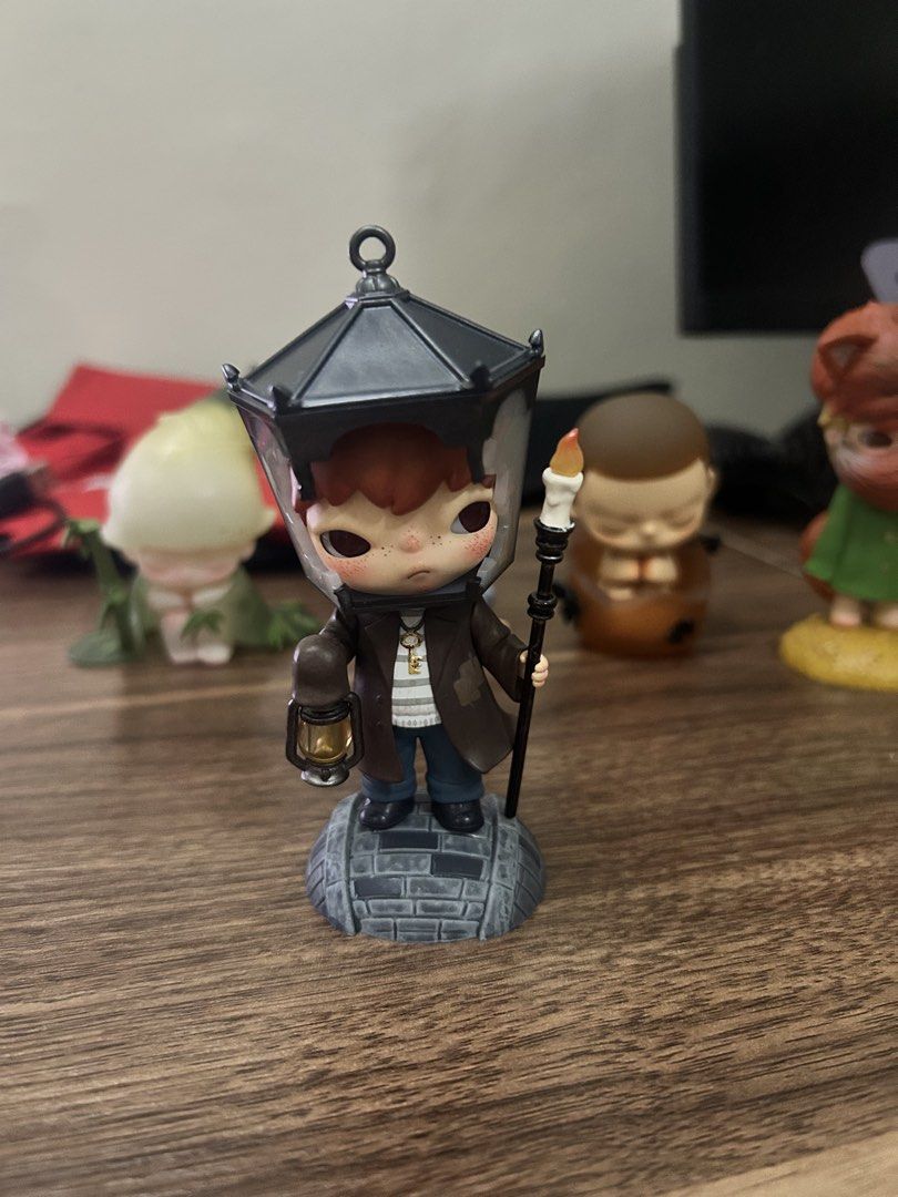 POPMART HIRONO X LE PETIT PRINCE (Category: Designer & Blind Box Toys) located in Manila. Submitted by mihos.garage.sale (Listing ID 1470187079, Image 1). Description: - Brand: Pop Mart hirono Collectible Figure - Design: Wearing a brown coat and street lamp hat - Accessories: Holding a candlestick and tiny lantern - Base: Includes a detailed cobblestone base - Condition: Brand new / Mint in box (Great for display on desks or shelves).