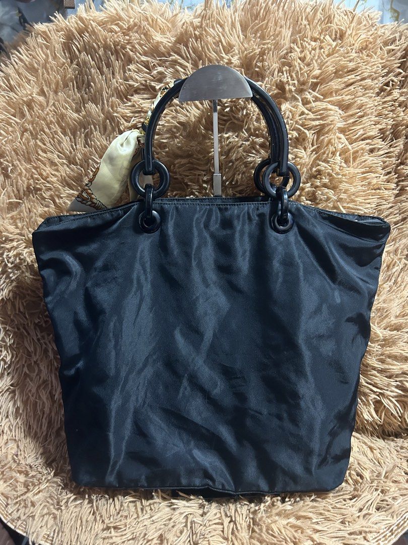 Prada back Nylon shoulder Bag (Category: Luxury Bags & Wallets) located in Iloilo. Submitted by thrift-to-thrift-ukay (Listing ID 1470294277, Image 2). Description: Authentic/Legit Prada black Nylon shoulder bag Size Medium Rank Ab Condition All goods condition ang Body nylon nya Pm for more details.