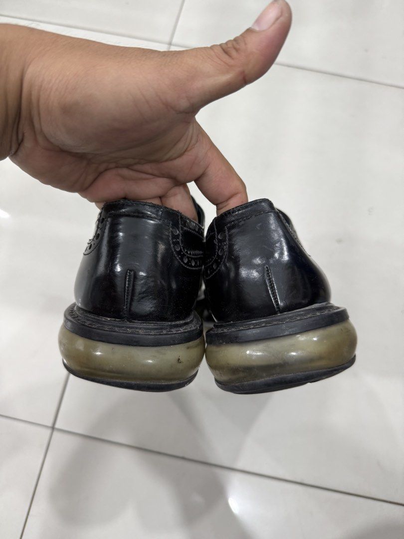 Prada Black Leather Brogues (Category: Dress Shoes) located in Bacolod City. Submitted by kitcarsonduff (Listing ID 1470190065, Image 3). Description: - Brand: Prada - Style: Classic black leather wingtip brogues with lace-up closure - Soles: Chunky rubber soles with traction tread pattern - Branding: Prada logo printed on the insole - Condition: Pre-loved with natural leather creasing and minor sole wear - Perfect for smart-casual wear, work, or