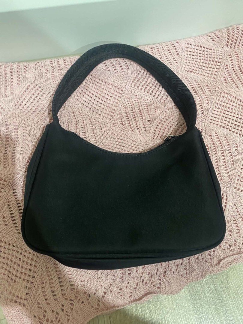 Black Nylon Mini Hobo Bag (Category: Luxury Bags & Wallets) located in Quezon City. Submitted by vintagepurse.vault (Listing ID 1470191418, Image 3). Description: - Material: Durable black nylon - Condition: Clean structure, great for daily wear - No issues.