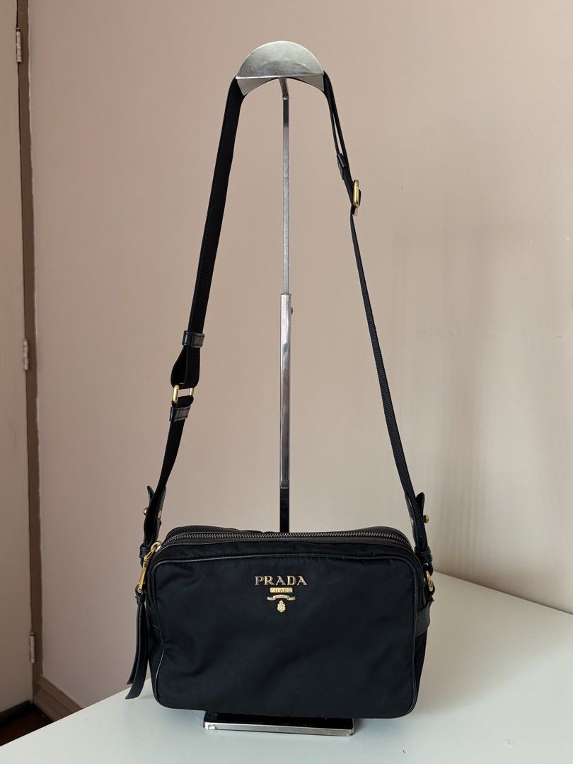 Prada Nylon Camera Bag (Category: Luxury Bags & Wallets) located in Antipolo. Submitted by kylie.ver (Listing ID 1470156336, Image 2). Description: Nylon Camera Bag | ₱26000 Inclusions: authenticity card Pre-loved with signs of use — minor cracks on leather pipings & slight fading on gold hardware RFS: hindi na po nagagamit.