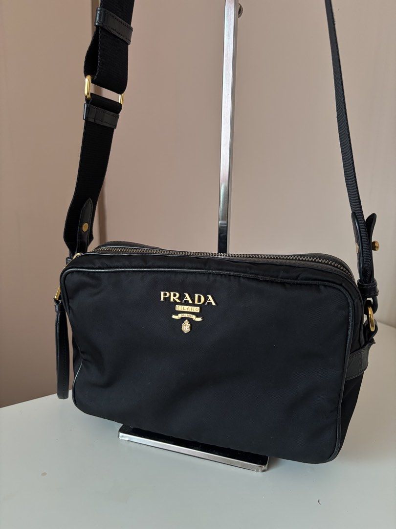 Prada Nylon Camera Bag (Category: Luxury Bags & Wallets) located in Antipolo. Submitted by kylie.ver (Listing ID 1470156336, Image 3). Description: Nylon Camera Bag | ₱26000 Inclusions: authenticity card Pre-loved with signs of use — minor cracks on leather pipings & slight fading on gold hardware RFS: hindi na po nagagamit.