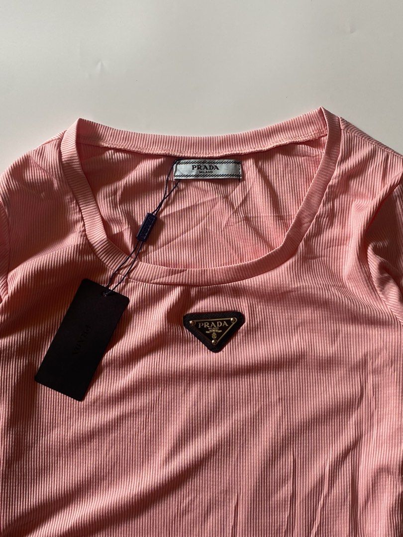 Prada Ribbed Longsleeve Top (Category: Longsleeves) located in Makati City. Submitted by la_femme_by_bncks (Listing ID 1470259941, Image 3). Description: Length 24 Width 15 *each* Measured it by inches Issue: N/A This is a pre-loved/thrifted items and may show minor signs of issue due to its vintage nature. Kindly manage expectations. No refunds or exchanges will be accepted. 📍Pasay City DM for inquiries..