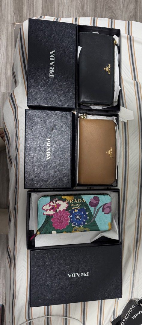 Prada Saffiano Wallets (Category: Luxury Bags & Wallets) located in Iloilo. Submitted by lorenzoivan (Listing ID 1470273631, Image 1). Description: Prada Saffiano Wallet in Black -₱11,000 good condition box only (NEGOTIABLE) Prada Saffiano Wallet in Brown -₱6,000 very used condition box only (NEGOTIABLE) Prada Saffiano Stampato Wallet in Floral Print -₱16,000 good condition with box and cards (NEGOTIABLE) ALL LEGIT / AUTHENTIC TAKE ALL: ₱28,000 (