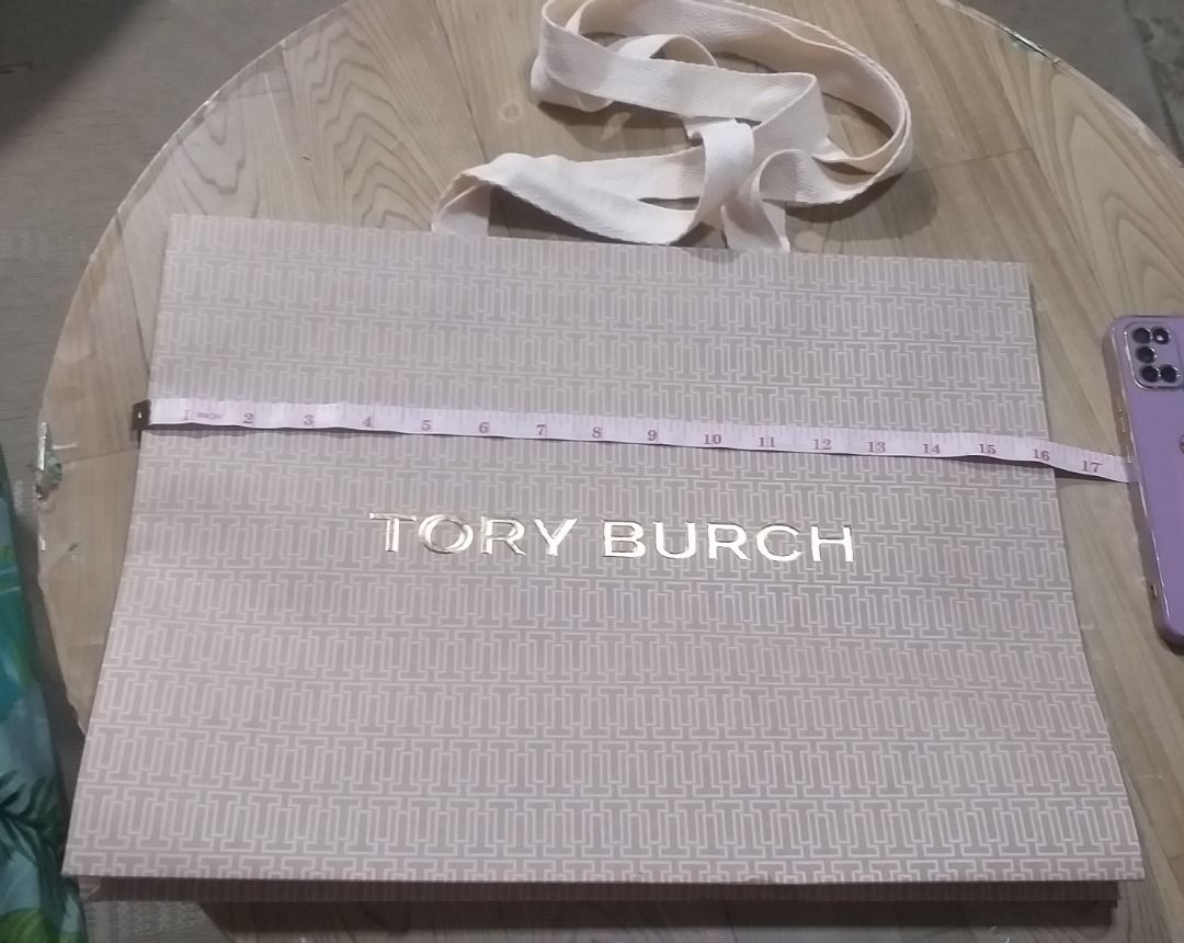 preloved Tory Burch Designer Paper Bag (Category: Tote Bags) located in Pasig City. Submitted by jocel8432 (Listing ID 1470207176, Image 1). Description: - 100% Authentic Tory Burch paper shopping bag - Features the iconic T Monogram pattern in a chic pink and beige colorway - Designed with durable cream fabric ribbon handles - Ideal for gifting, organizing, or adding to your designer packaging collection.