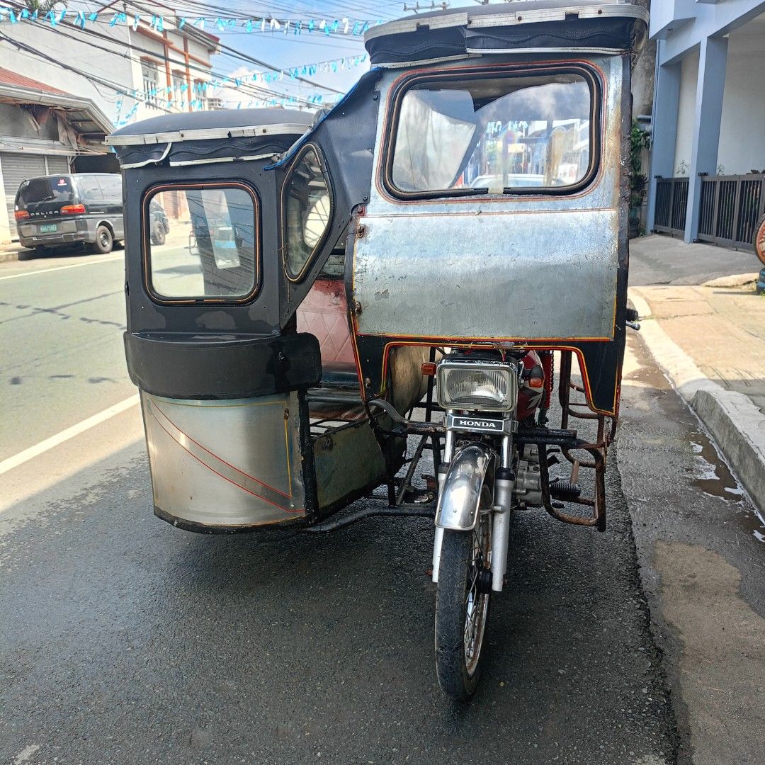 Project tricycle (Category: Motorbikes for Sale) located in Manila. Submitted by happyhorse_ca28fa (Listing ID 1470294811, Image 2). Description: FOR SWAP OR SALE: Honda TMX Alpha 125 Complete Papers (Paso lang) Gana Headlight & Taillight Good Running Issue: Preno sa una, Nakarekta, Walang plate pero nasa papel na, pagawa mo lang. The rest kutingting lang. Swap Prefer: M3 / Raider / Click Sale: PM sa offer.