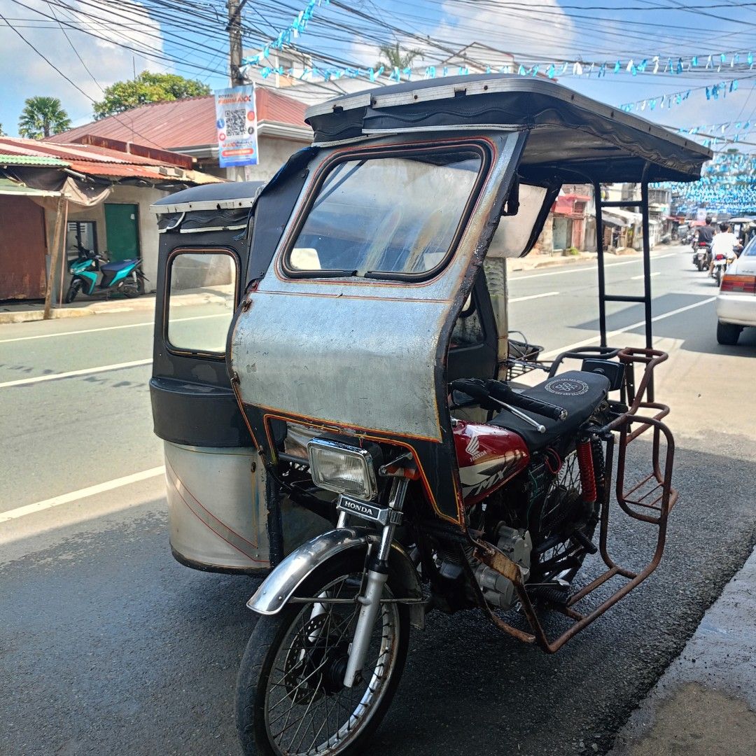 Project tricycle (Category: Motorbikes for Sale) located in Manila. Submitted by happyhorse_ca28fa (Listing ID 1470294811, Image 1). Description: FOR SWAP OR SALE: Honda TMX Alpha 125 Complete Papers (Paso lang) Gana Headlight & Taillight Good Running Issue: Preno sa una, Nakarekta, Walang plate pero nasa papel na, pagawa mo lang. The rest kutingting lang. Swap Prefer: M3 / Raider / Click Sale: PM sa offer.