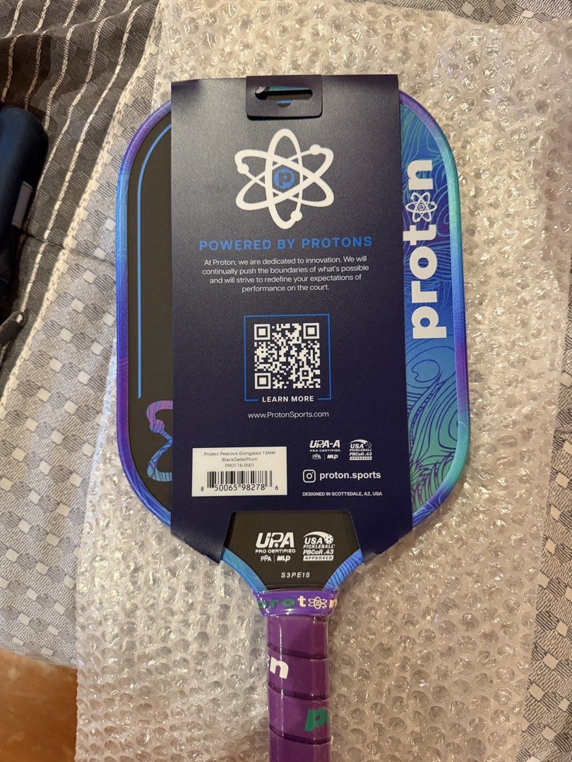 Proton Series Three Project Peacock Elongated 15mm Paddle (Category: Racket and Ball Sports) located in Cebu City. Submitted by juicyjjjj (Listing ID 1470230076, Image 2). Description: - Brand new in original packaging with cardboard sleeve intact - Model: Proton Series Three - Project Peacock (15mm Elongated) - Colorway: Black / Jade / Plum - Certifications: UPA-A Pro Certified & USA Pickleball PBCoR.43 Approved Won in a tournament. Free shippin