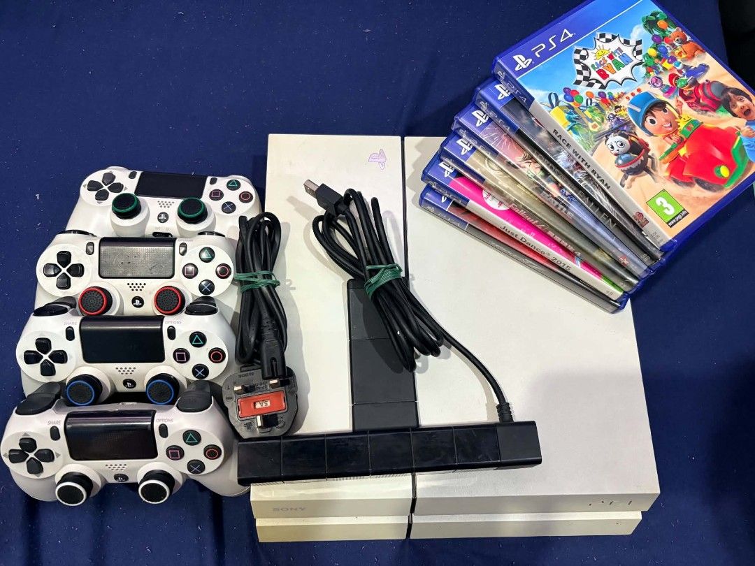 PS4 Console Bundle with 4 Controllers Camera and Games (Category: PlayStation) located in Quezon City. Submitted by xelramos22 (Listing ID 1470298700, Image 1). Description: - PS4 console bundle in great working condition - Includes 4 white controllers - Comes with PlayStation camera and power cable - Includes 6 popular games: Race With Ryan, Lords of the Fallen, Battle, Fallout 4, Just Dance 2015, and Tekken 7 - Everything powers up normally - P