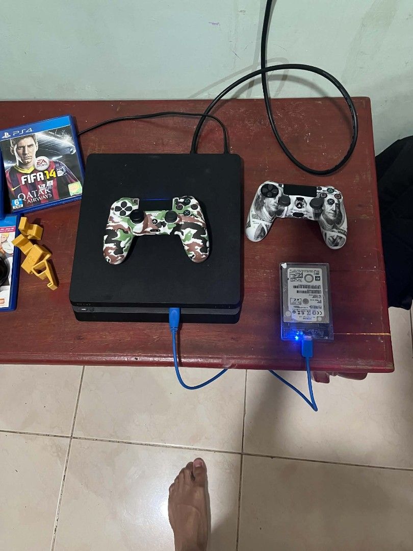 PS4 SLIM 13.52 1TB (Category: PlayStation) located in Manila. Submitted by braveforest_dfedeb (Listing ID 1470154719, Image 2). Description: 13.52 system 1terabyte ps4 slim with external 500gb have good tier downloaded games physical disc freebies charging dock ps4 stand hdmi cable. All goods condition. Unit no hidden issue also the hdd purchase games farcry 6 cod mw2 re7 re8 ghost of tsushima directors cut sf6 different account lang per games ka