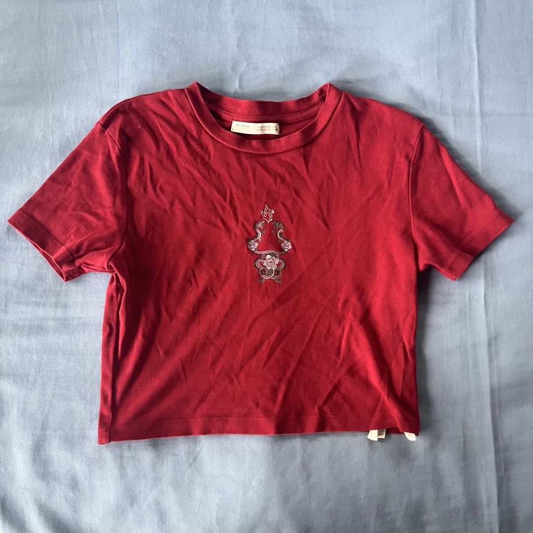 Pull&Bear Red Snake Crop T-Shirt Size S (Category: Shirts) located in Bocaue. Submitted by frankie_1818 (Listing ID 1470188338, Image 1). Description: - Design: Red short sleeve crop top with center snake and rose embroidery, round ribbed collar - only worn twice loc: UST manila .