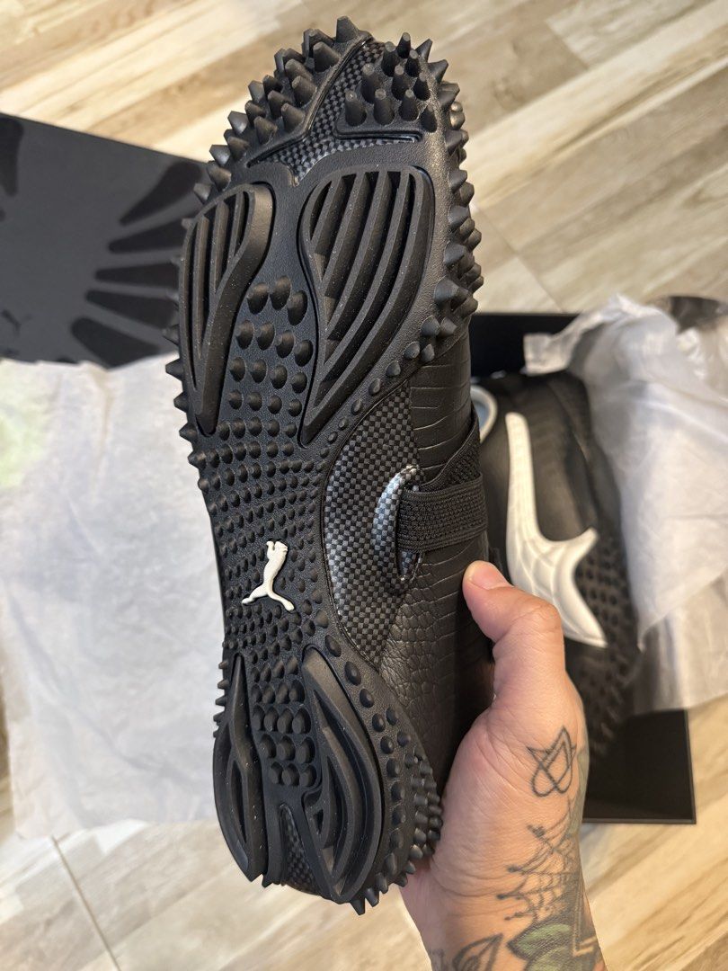 Puma A$AP Rocky Mostro US 11 (Category: Sneakers) located in Manila. Submitted by safeowl.b6dbb0 (Listing ID 1470337506, Image 2). Description: - Brand: Puma x A$AP Rocky - Color: Black and Silver - Material: Croc-embossed leather texture - Design: Strap closure, signature silver side formstrip, and aggressive spiked rubber sole wrapping up the heel and toe - Packaging: Includes original black box and tissue paper - Condition: Brand new / Complet