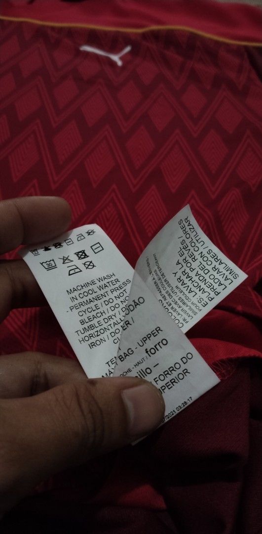Puma Red Diamond Pattern Polo Shirt (Category: Tshirts & Polo Shirts ) located in Manila. Submitted by ianmontede19006 (Listing ID 1470174423, Image 3). Description: - 100% Authentic Puma merchandise - Size: Medium (M) - Color: Red with white Puma logo on the chest - Design: Geometric diamond pattern across the lower front section - Features: Classic collar neckline and short sleeves - Origin: Made in Vietnam.