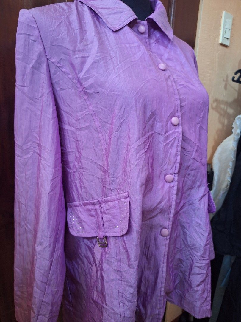 2000s Style Purple button-down jacket with pocket detailing (Category: Coats, Jackets and Outerwear) located in Balamban. Submitted by ubethan (Listing ID 1470214154, Image 2). Description: - Color: Purple - Material: Lightweight crinkled fabric - Closure: Button-front with matching round buttons - Pockets: Two chest pockets with buckled straps and rhinestone details - Features: Long sleeves, collar, and a matching back waist strap.