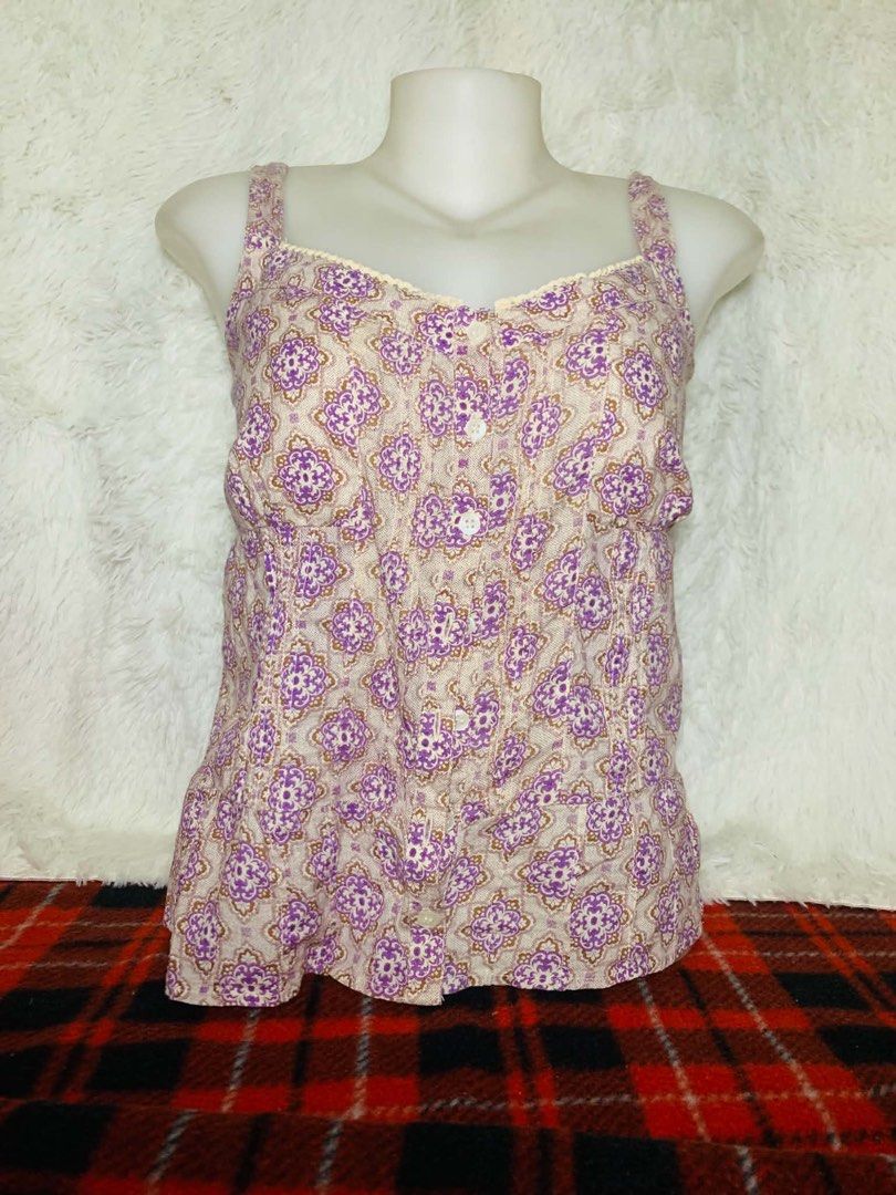 Purple Damask Print Button-Front Tank Top (Category: Sleeveless) located in Tanjay. Submitted by madscart (Listing ID 1470156753, Image 1). Description: - Style: Purple damask print tank top with button-down front - Neckline: Square neck with delicate lace trim - Straps: Comfortable thick shoulder straps - Material: Soft, lightweight, and breathable fabric - Perfect for: Warm weather days, easily paired with white linen pants or jeans.
