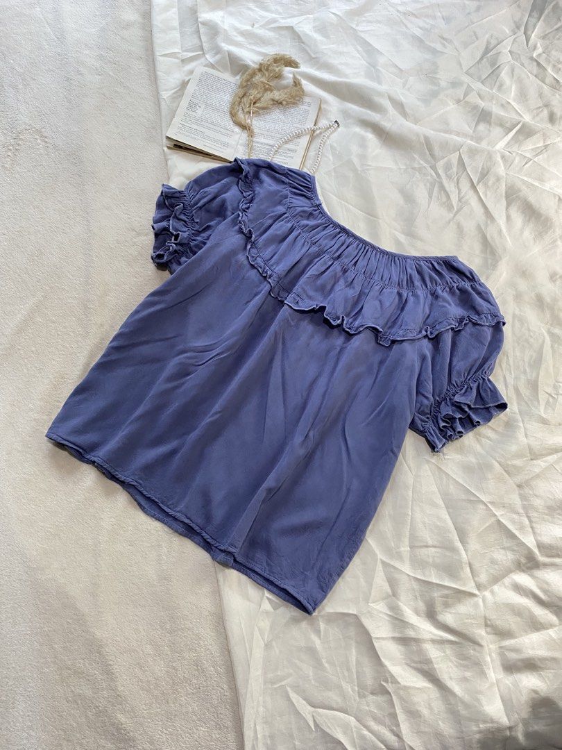 Purple ruffled short sleeve blouse Large 40 (Category: Blouses) located in Poro. Submitted by joyceyuu (Listing ID 1470165338, Image 3). Description: - Color: Purple - Sleeves: Short sleeve with ruffle details - Neckline: Gathered elastic collar with ruffles - Fit: Loose and comfortable - Styling: Easy to match with jeans or skirts.