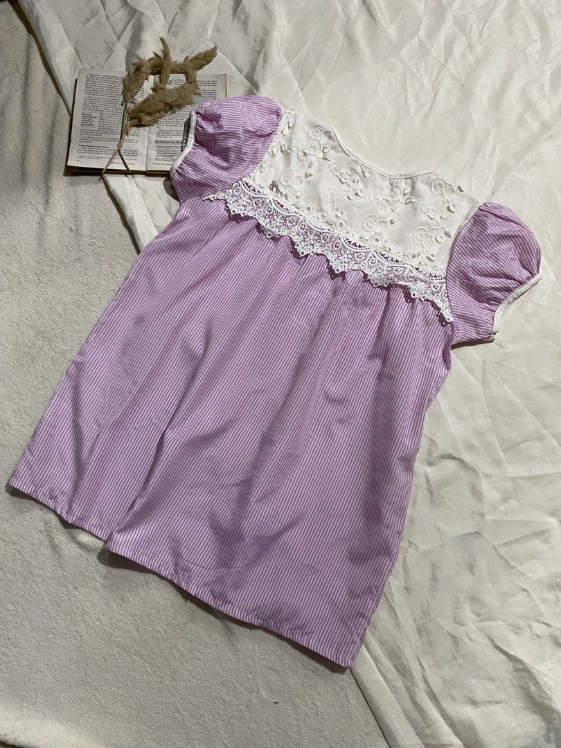 Purple striped button-down blouse with white lace yoke Small-Medium 37 (Category: Blouses) located in Poro. Submitted by joyceyuu (Listing ID 1470184552, Image 3). Description: - Style: Cottagecore / Casual Daily Wear - Design: Purple & white stripes with white embroidered lace yoke - Sleeves: Short puff sleeves with elastic cuffs - Details: Button-down front closure with cute .