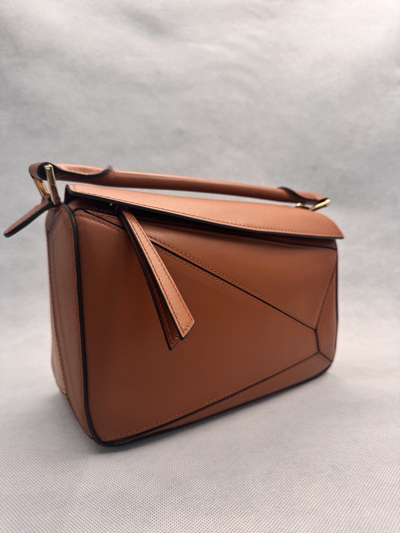 Puzzle Bag (Tan) - Italian Leather (Category: Shoulder Bags) located in Las Pinas. Submitted by uynice.ph (Listing ID 1470213315, Image 2). Description: 🤎 ITALIAN LEATHER PUZZLE-STYLE BAG | TAN ✨ Get that luxury look for less! Love the iconic geometric silhouette? This designer-inspired bag is chic, versatile, and effortlessly stylish! A structured Italian leather bag featuring geometric panel detailing, gold-tone hardware, and a timeless tan fi
