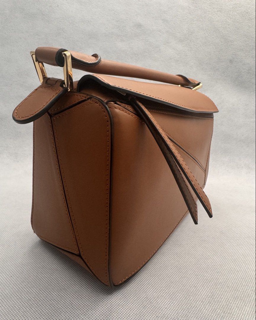 Puzzle Bag (Tan) - Italian Leather (Category: Shoulder Bags) located in Las Pinas. Submitted by uynice.ph (Listing ID 1470213315, Image 3). Description: 🤎 ITALIAN LEATHER PUZZLE-STYLE BAG | TAN ✨ Get that luxury look for less! Love the iconic geometric silhouette? This designer-inspired bag is chic, versatile, and effortlessly stylish! A structured Italian leather bag featuring geometric panel detailing, gold-tone hardware, and a timeless tan fi