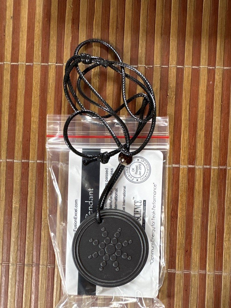 Quantum Science Energy Pendant Japanese Technology (Category: Necklaces) located in Pasig City. Submitted by coolphoenix-29ac (Listing ID 1470176691, Image 1). Description: - Authentic Quantum Science Pendant with Japanese technology - Stylish black circular design with a geometric star pattern - Includes a black cord necklace for ready-to-wear convenience - Comes with an authenticity card featuring a scratch-off ID - Original FusionExcel Interna