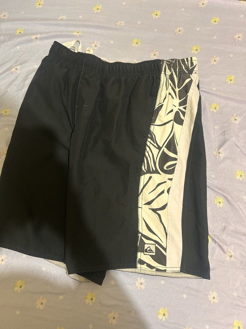 Quiksilver Black White Tropical Leaf Board Shorts (Category: Swim Trunks & Board Shorts) located in Manila. Submitted by luckystorm.219744 (Listing ID 1470298325, Image 1). Description: - Authentic Quiksilver board shorts in black and off-white - Stylish contrast side panel with a bold tropical leaf pattern - Iconic embroidered Quiksilver logo patch near the hem - Comfortable elastic waistband with adjustable drawstring closure - Lightweight, qui