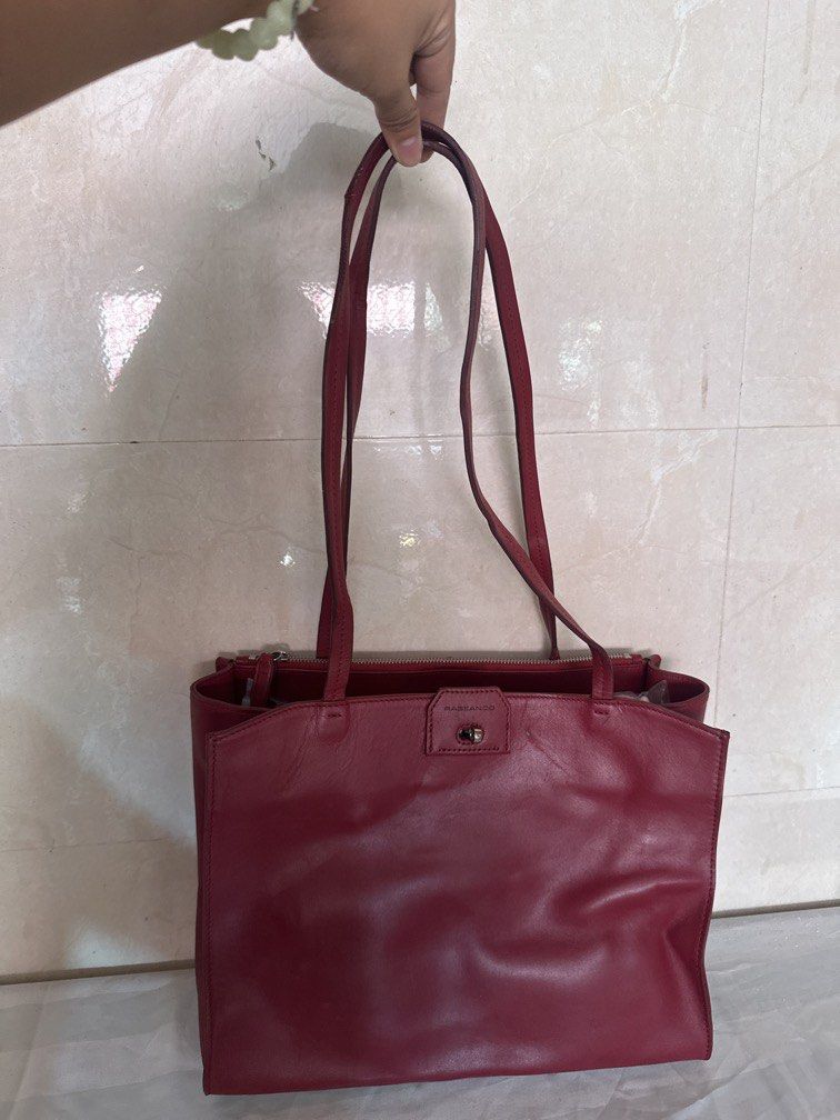 Rabeanco Office Shoulder Tote Bag (Category: Shoulder Bags) located in Caloocan City. Submitted by hariel_beverly_onlineshop (Listing ID 1470222294, Image 1). Description: This item is an authentic Rabeanco Red Leather Office Shoulder Bag, known for its classic, multi-compartment rectangular architecture that serves as a highly functional everyday or work tote. It is crafted from premium smooth cowhide leather and features comfortable dual should
