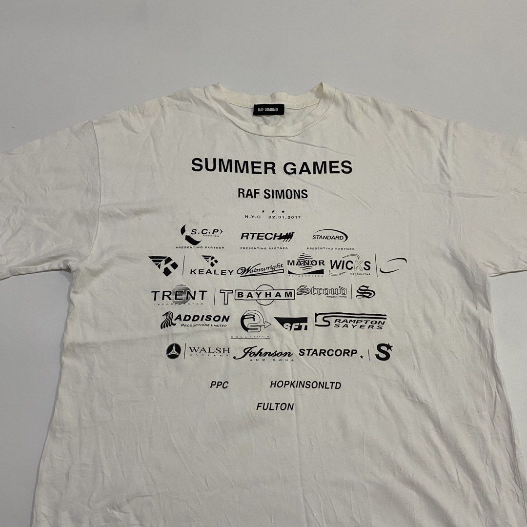 Raf Simons - F/W’17-18 Summer Games Tee (Category: Tshirts & Polo Shirts ) located in Cavite. Submitted by pastseas0n_ (Listing ID 1470185376, Image 3). Description: Raf Simons - Summer Games Tee Size : SMALL (fit to L) FLAT MEASUREMENTS Width : 21 inches Length : 30 inches Shoulder : 21 inches Sleeve : 7 inches 9/10 CONDITION Authentic Worn by DRAKE Made in Italy.