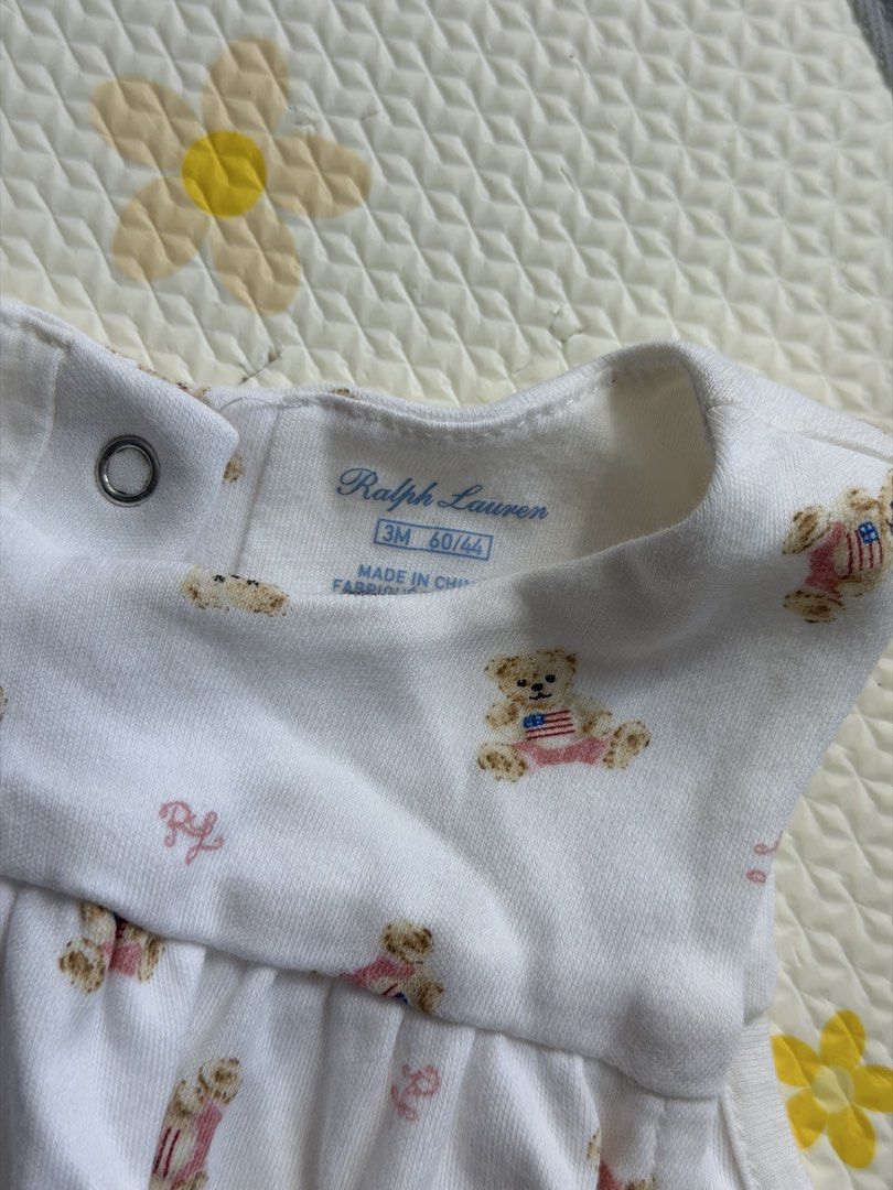 Ralph Lauren Baby Bear Print Footed Romper (Category: Babies & Kids Fashion) located in Quezon City. Submitted by adnct (Listing ID 1470217466, Image 2). Description: Authentic Ralph Lauren baby romper - Size: 3-6M - Color: White with adorable all-over Polo Bear print - Material: Super soft 100% cotton for everyday comfort - Design: Sleeveless with integrated feet - Closure: Snap buttons at the back and shoulder for easy dressing and diaper chang