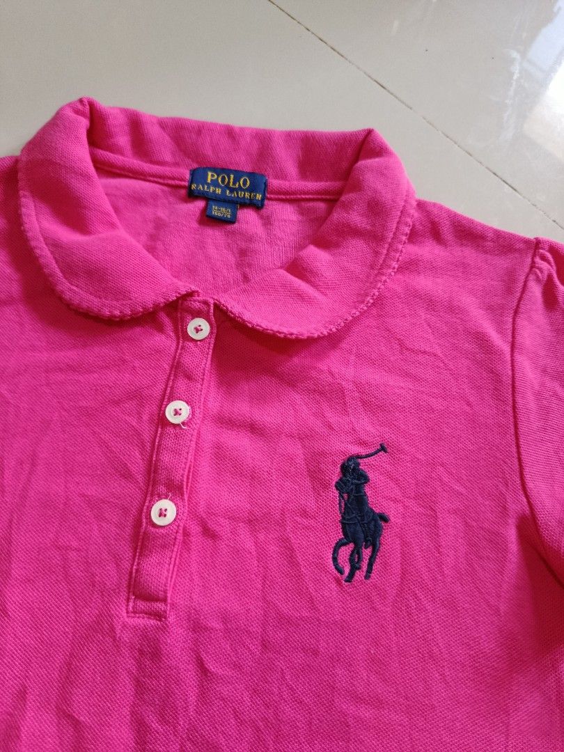 Ralph Lauren polo shirt (Category: Babies & Kids Fashion) located in Davao. Submitted by 07dward (Listing ID 1470162215, Image 3). Description: This pink Polo Ralph Lauren children's short-sleeve polo shirt features a Peter Pan collar with delicate ruffled trim.