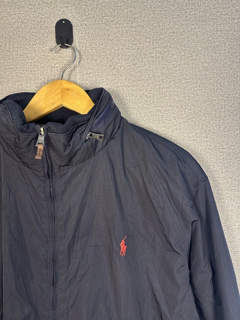 RALPH LAUREN WINDBREAKER W/ PACKABLE HOOD (Category: Coats, Jackets and Outerwear) located in Rizal. Submitted by jamesthrift (Listing ID 1470156168, Image 2). Description: RALPH LAUREN WINDBREAKER W/ PACKABLE HOOD Size : XL Dimes: -width 24.5 -length 27 Condition: excellent Color Rate: 9.5 Issue:none 🏷️999+sf.