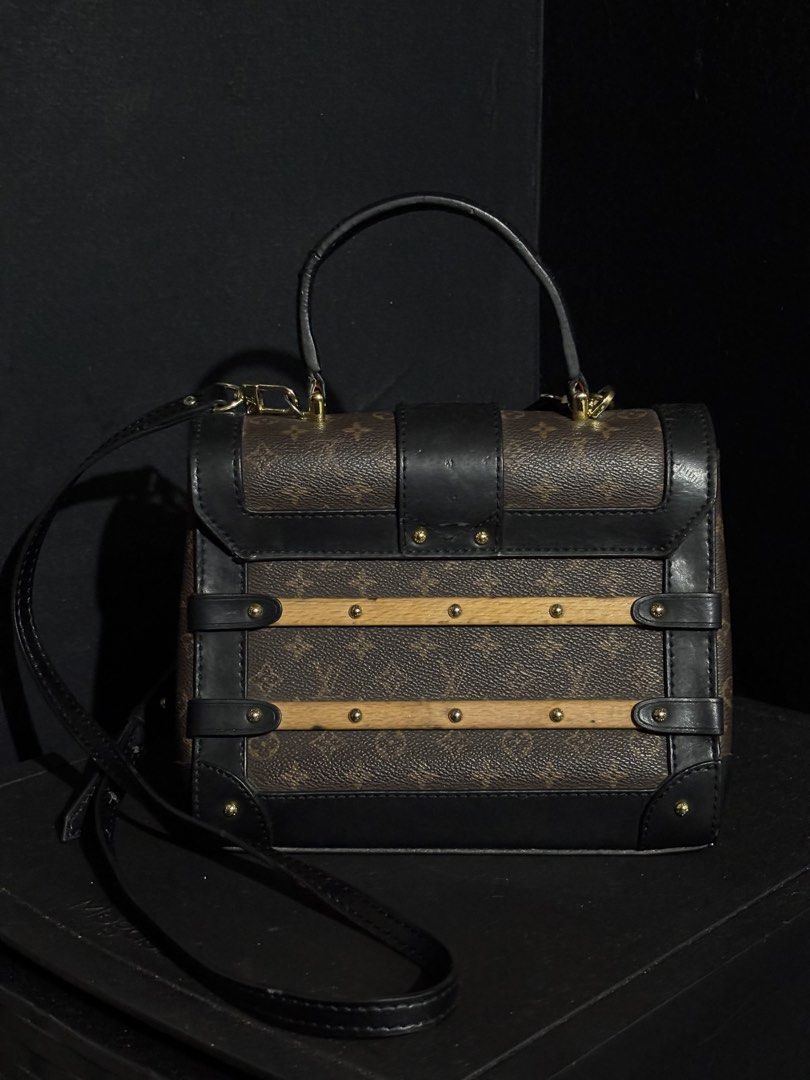 RARE LOUIS VUITTON TRIANON PM (Category: Luxury Bags & Wallets) located in Quezon City. Submitted by qr8d.ph (Listing ID 1470211279, Image 2). Description: ❗️PLEASE READ❗️ Item is a rare Louis Vuitton Trianon PM bag in classic monogram coated leather with black leather lining and gold hardware, it comes with a wooden accent on both front and back of the bag that gives it the classic trunk vibes where LV is very known for. Item comes with an adjus