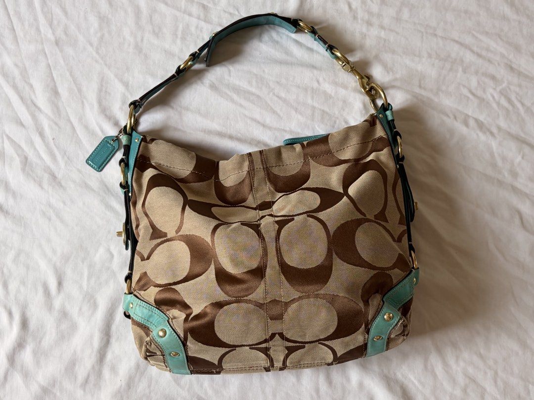 rare vintage y2k coach carly (Category: Luxury Bags & Wallets) located in Manila. Submitted by thriftygirliez (Listing ID 1464413141, Image 1). Description: Interior Flaws: - there are two small holes on the satin lining near the leather creed patch. - staining inside the wall pocket !! both flaws are strictly internal and completely hidden when wearing the bag !! price is negotiable.