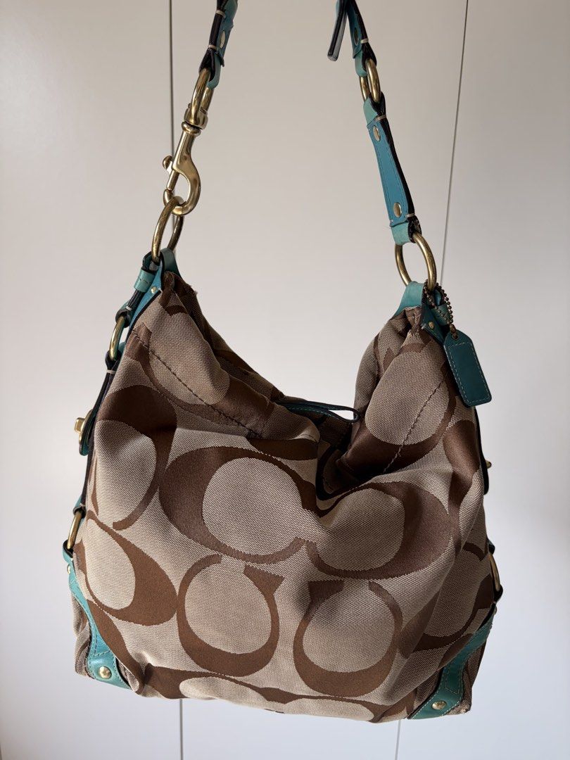 rare vintage y2k coach carly (Category: Luxury Bags & Wallets) located in Manila. Submitted by thriftygirliez (Listing ID 1464413141, Image 2). Description: Interior Flaws: - there are two small holes on the satin lining near the leather creed patch. - staining inside the wall pocket !! both flaws are strictly internal and completely hidden when wearing the bag !! price is negotiable.